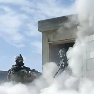 swat team covered in smoke