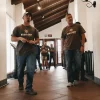 Group of men with guns in a hallway of a building